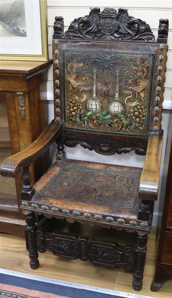 Two carved Spanish elbow chairs
